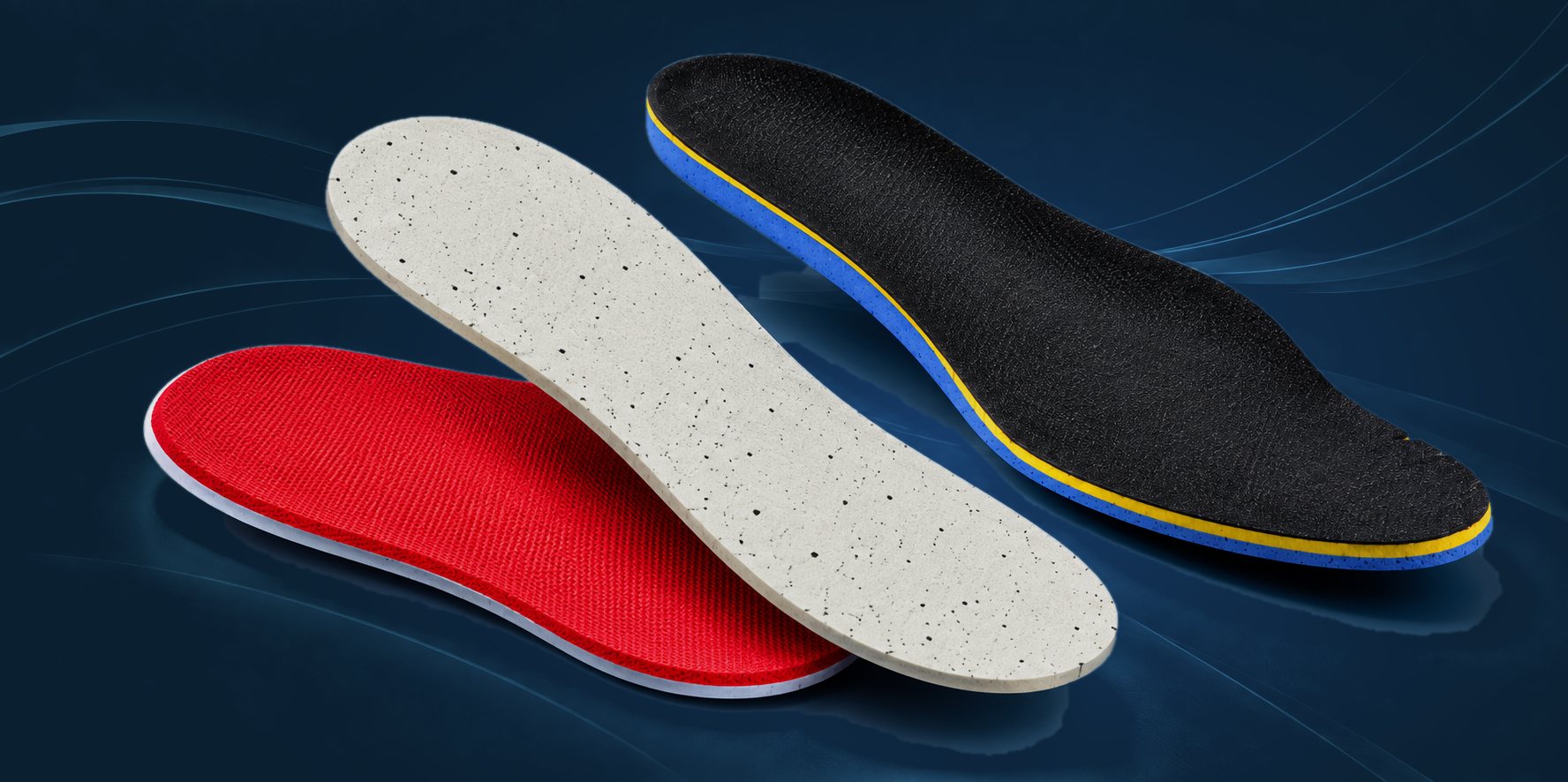 Three LITESOCK die-cut EVA sockliners: red, speckled white and black with a blue base